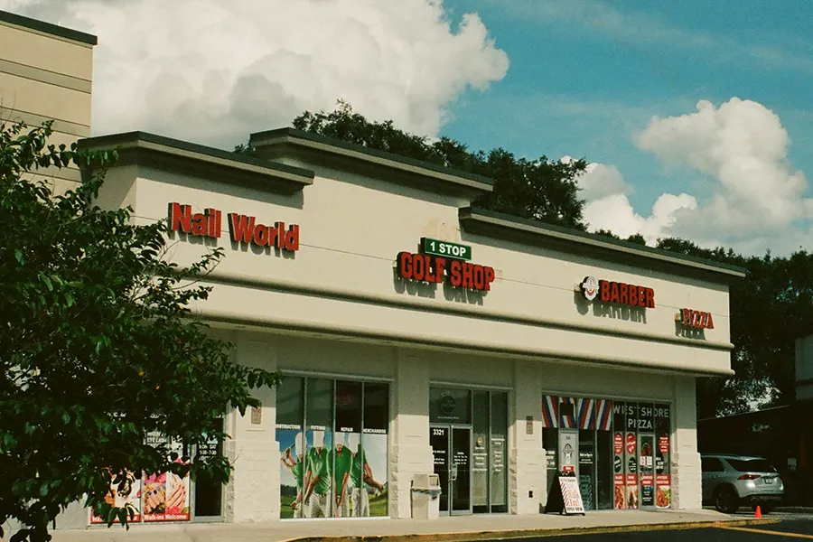 A view of some storfronts in a stip mall